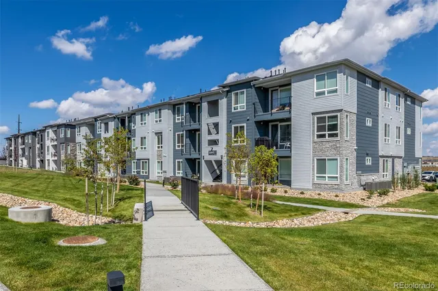 a front view of a house with a yard table and chairs