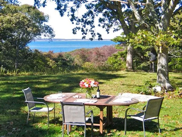 a outdoor view with a sitting space table and chairs