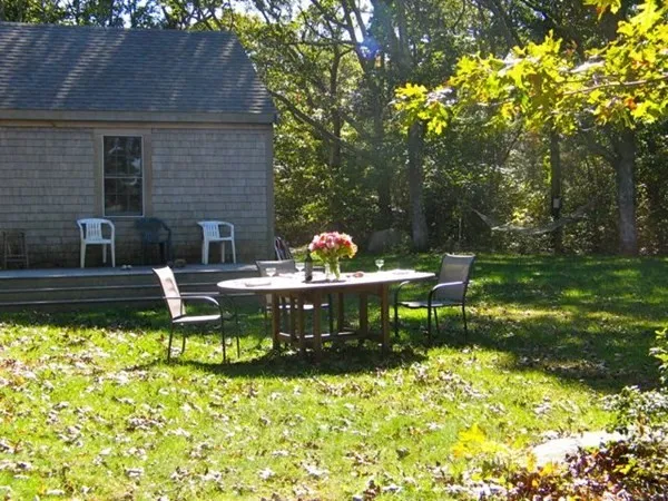 a view of grassy field with benches