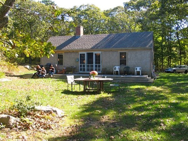 58 Forest Road West Tisbury, MA 02568 - Photo 24 of 29 a front view of house with yard and seating area