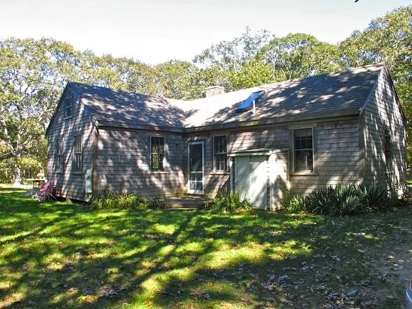 a patio with table and chairs