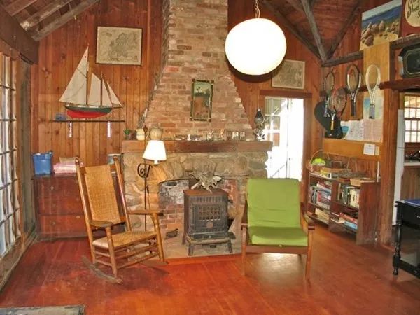 a living room with furniture a window and a table