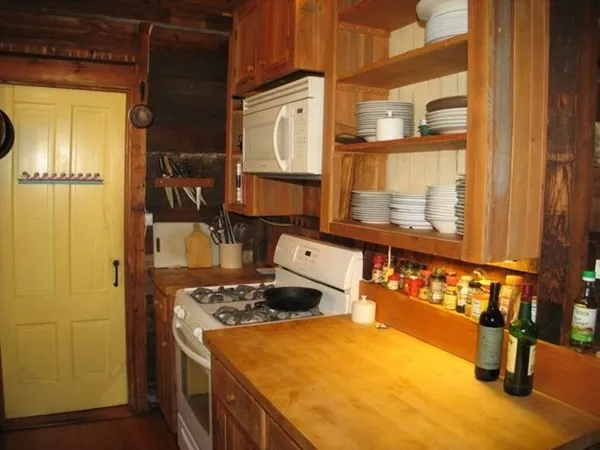 a kitchen with a sink a stove and refrigerator