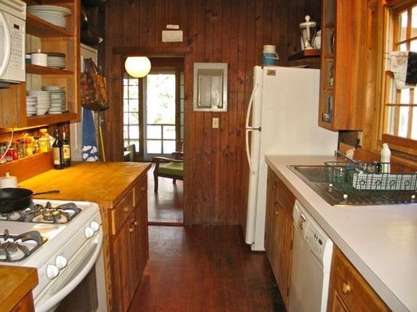 58 Forest Road West Tisbury, MA 02568 - Photo 8 of 29 a kitchen with a sink a stove and refrigerator
