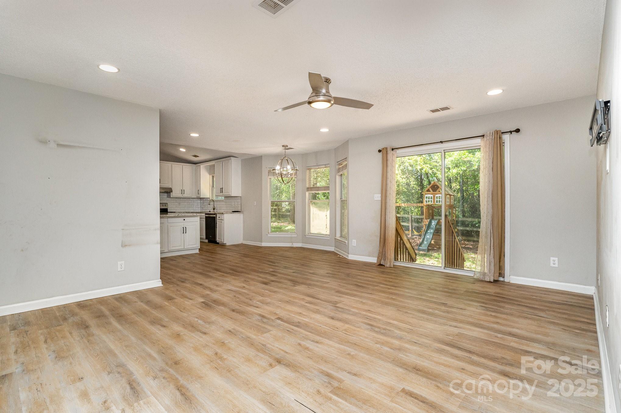 2014 Cardinal Loop Stanley, NC 28164 - Photo 11 of 40 a view of empty room with wooden floor and fan