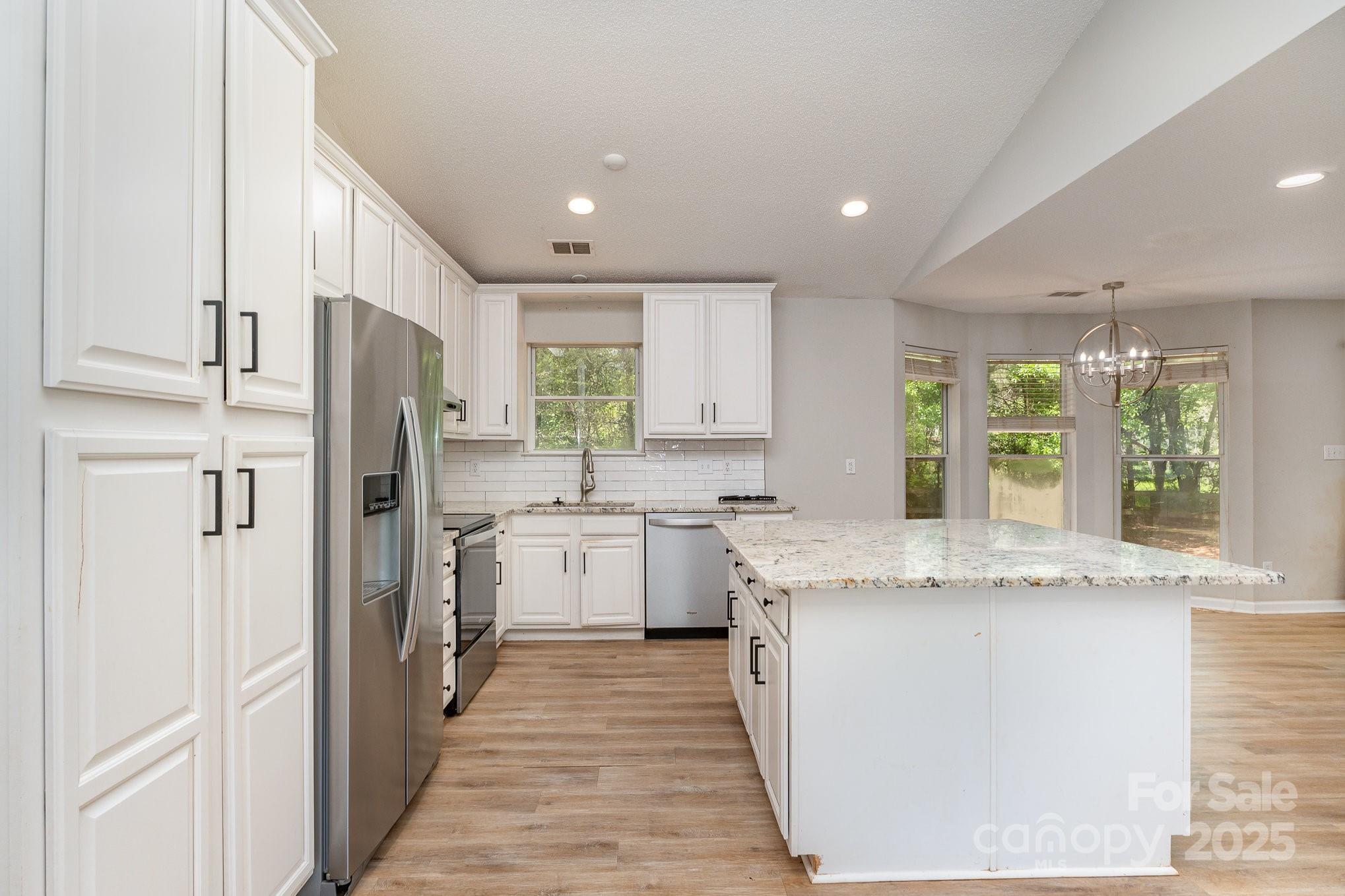 2014 Cardinal Loop Stanley, NC 28164 - Photo 18 of 40 a kitchen with a sink stove and refrigerator