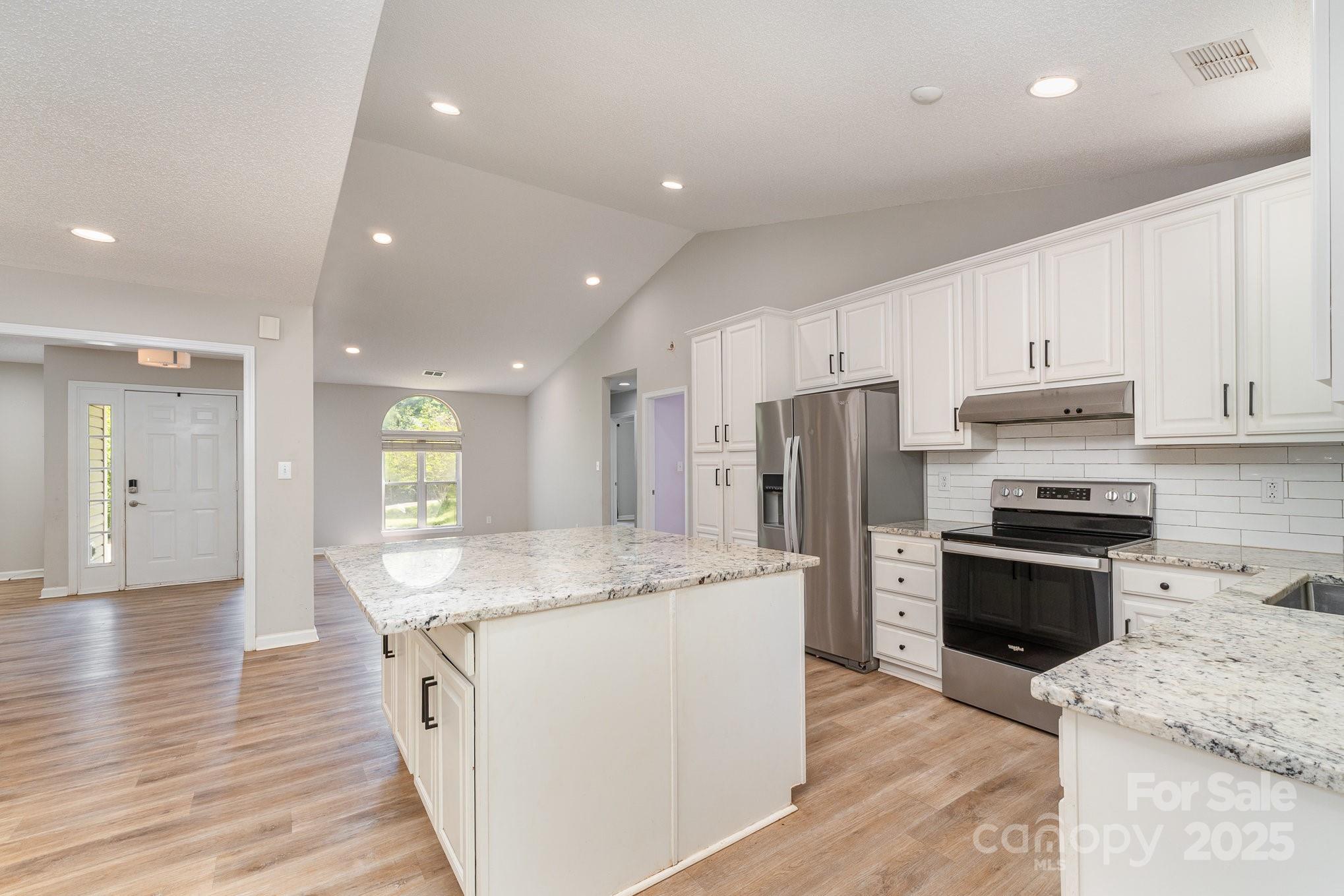 2014 Cardinal Loop Stanley, NC 28164 - Photo 19 of 40 a kitchen with stainless steel appliances granite countertop a refrigerator a sink a stove and oven