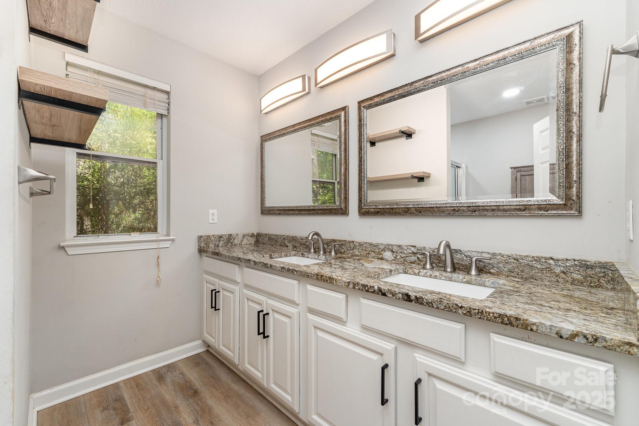 2014 Cardinal Loop Stanley, NC 28164 - Photo 25 of 40 a bathroom with a granite countertop sink mirror and