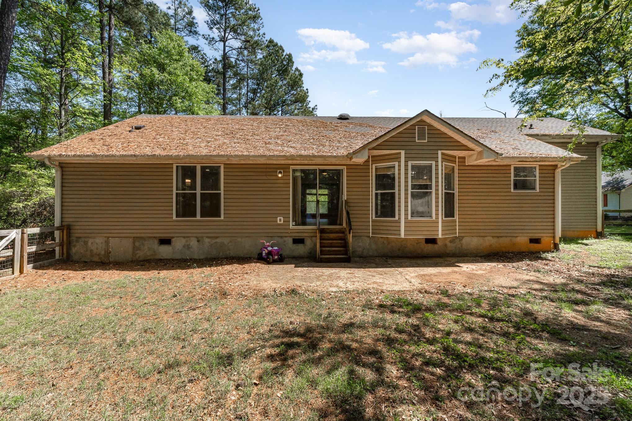 2014 Cardinal Loop Stanley, NC 28164 - Photo 35 of 40 a front view of a house with a garden