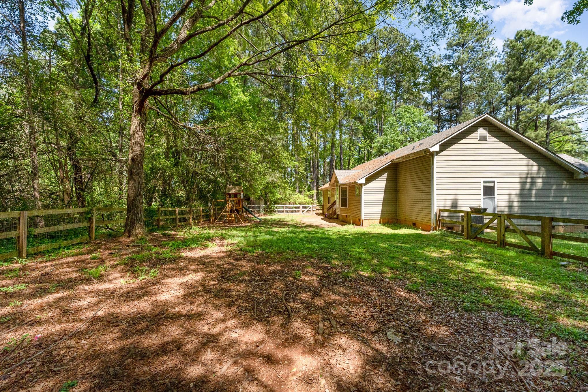 2014 Cardinal Loop Stanley, NC 28164 - Photo 38 of 40 a view of a house with yard and sitting area