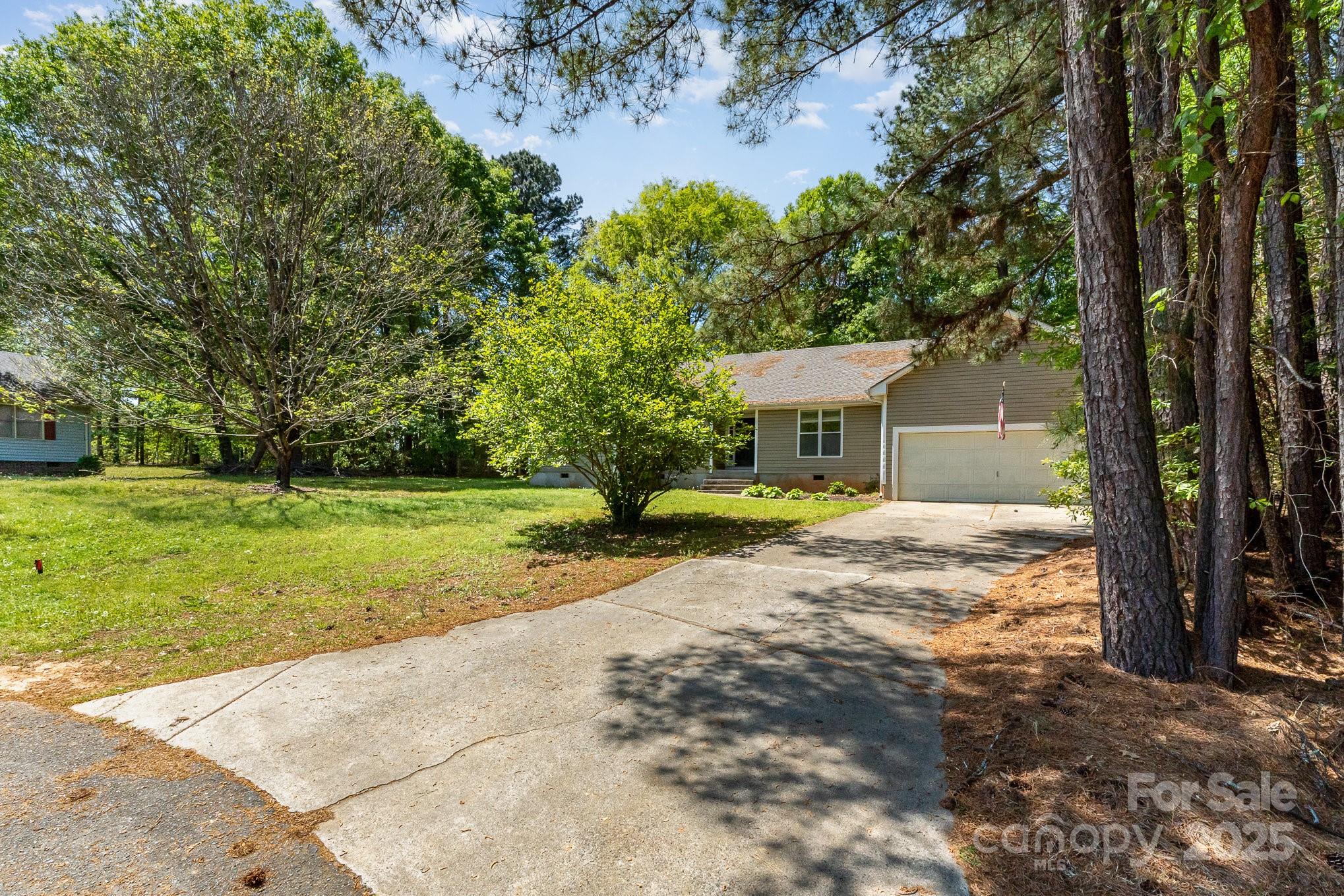 2014 Cardinal Loop Stanley, NC 28164 - Photo 4 of 40 a view of a house with backyard and tree