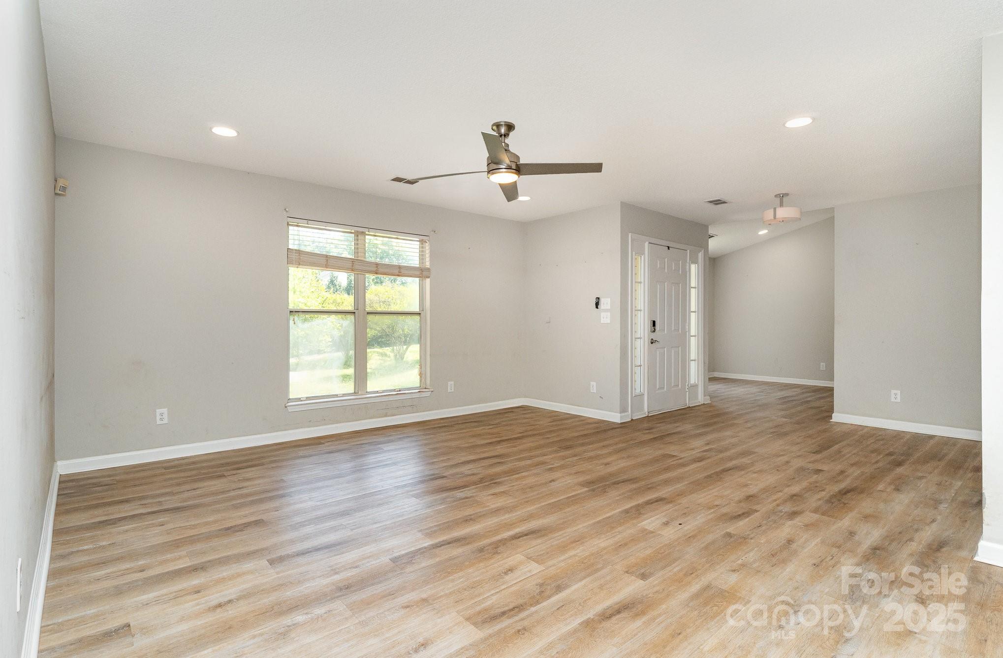 2014 Cardinal Loop Stanley, NC 28164 - Photo 9 of 40 a view of empty room with wooden floor and fan
