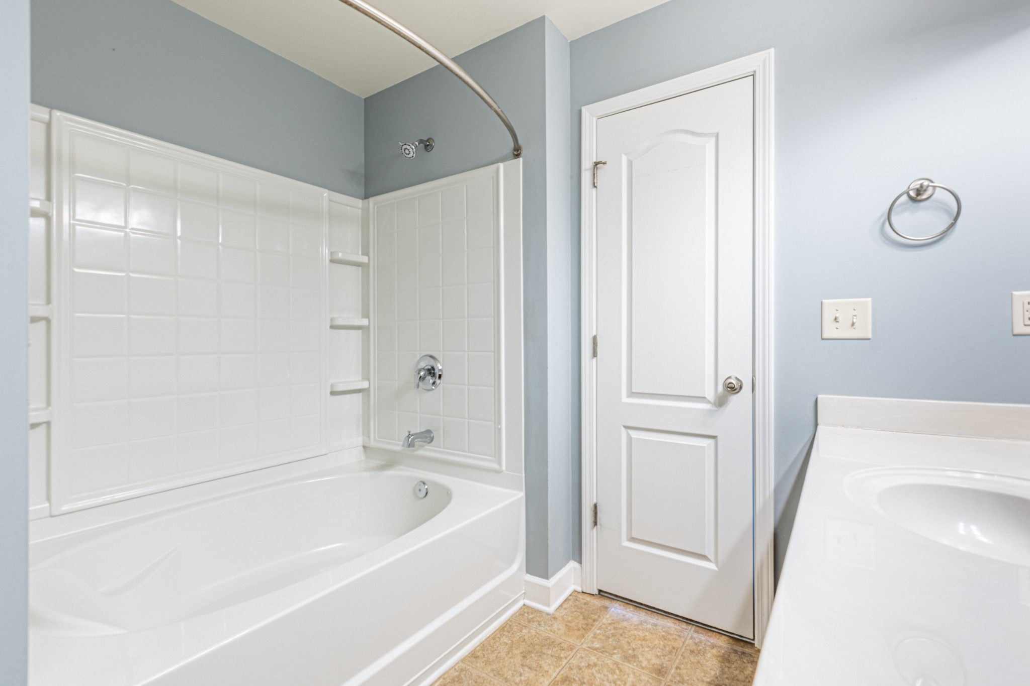 735 Tulip Grove Road, Unit 309 Hermitage, TN 37076 - Photo 15 of 18 a bathroom with a tub shower and vanity