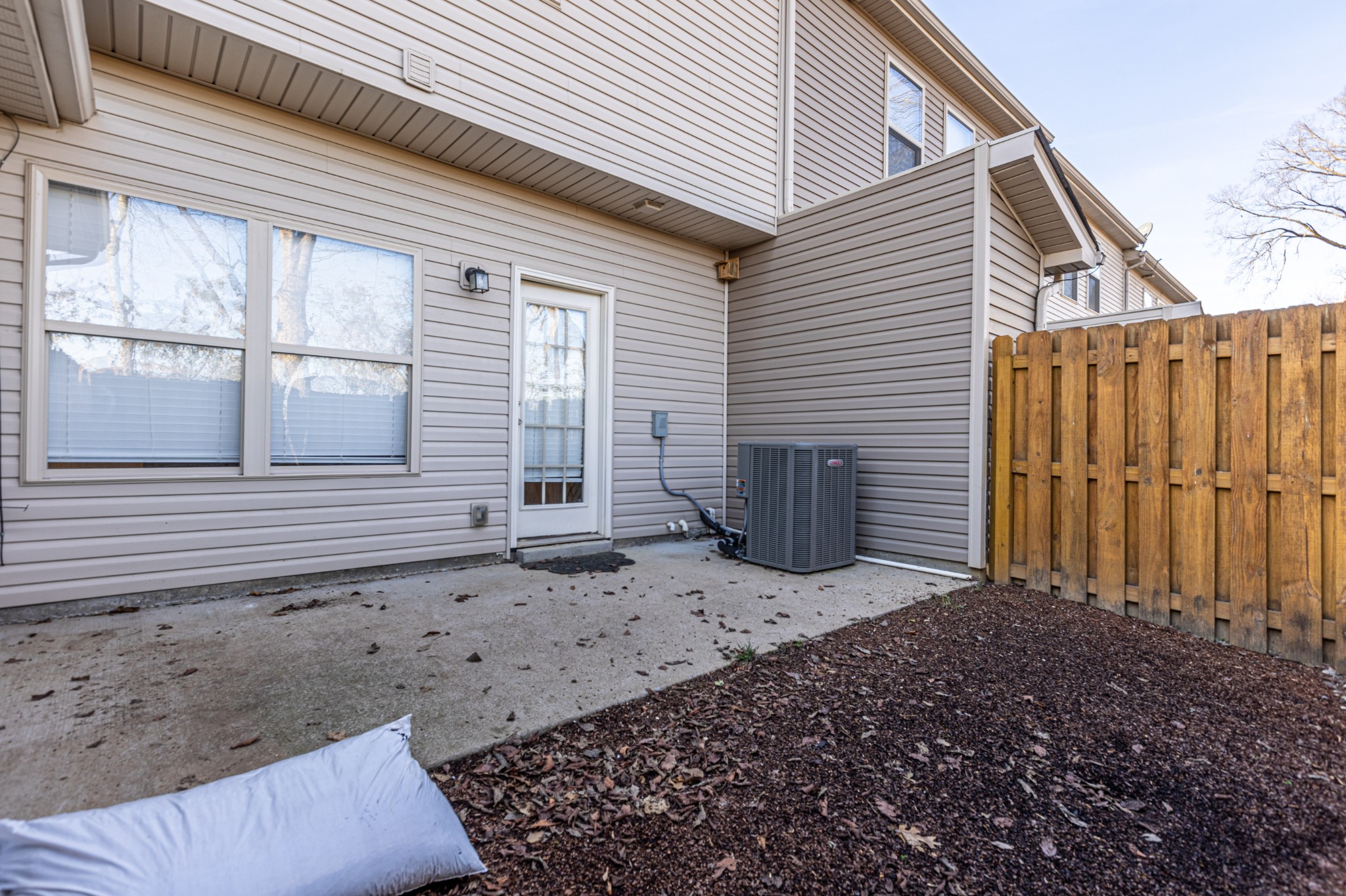 735 Tulip Grove Road, Unit 309 Hermitage, TN 37076 - Photo 16 of 18 a view of a backyard with wooden fence