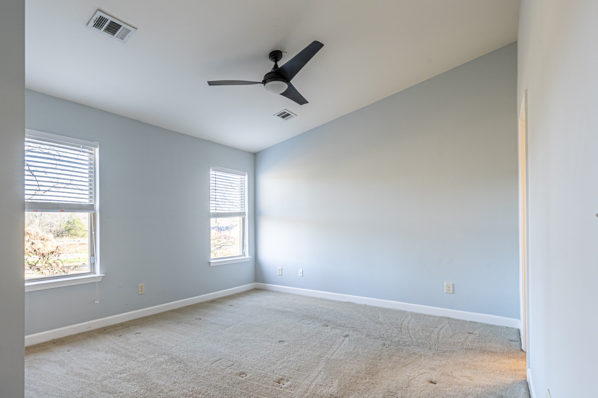 735 Tulip Grove Road, Unit 309 Hermitage, TN 37076 - Photo 5 of 18 wooden floor in an empty room with a window