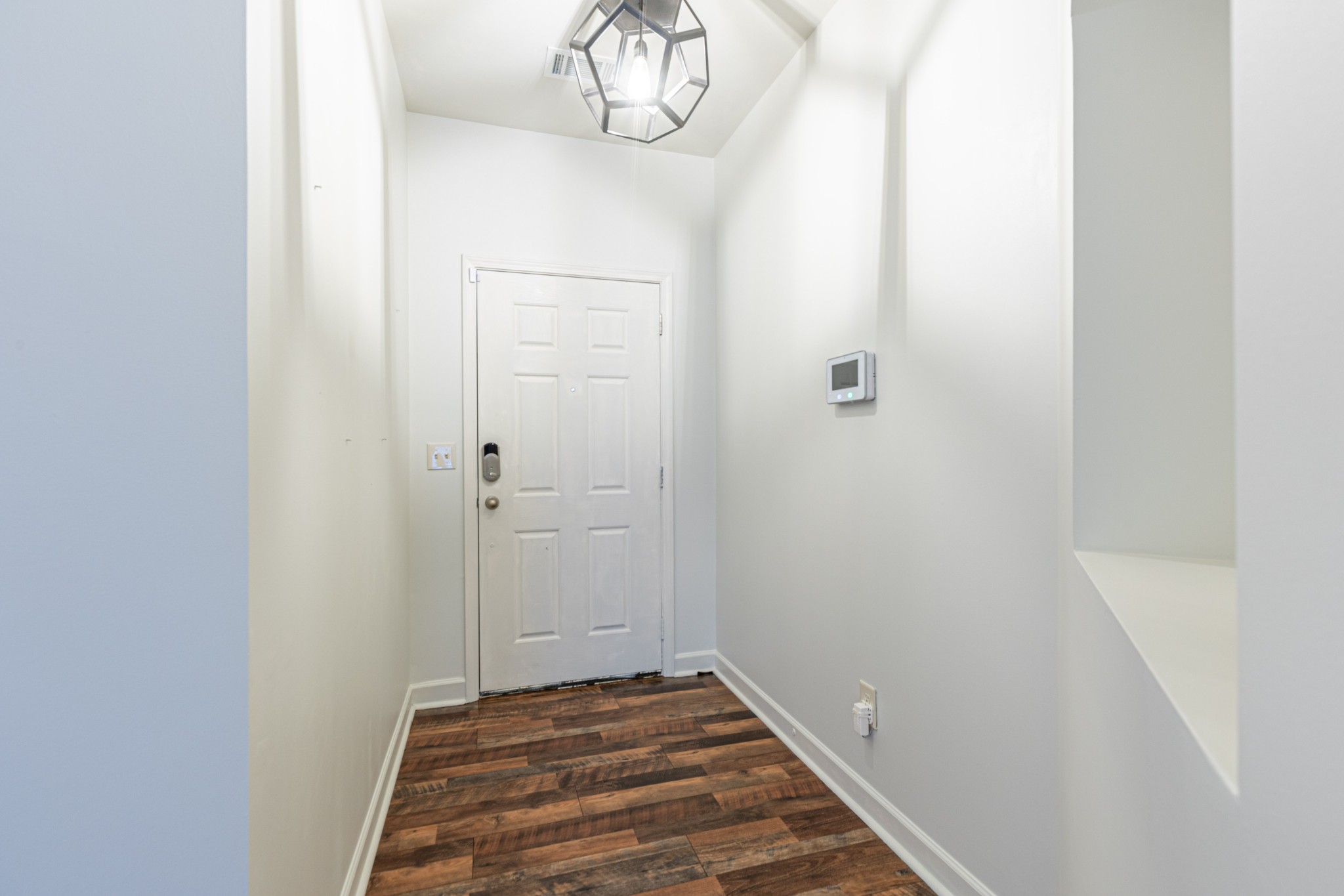 735 Tulip Grove Road, Unit 309 Hermitage, TN 37076 - Photo 6 of 18 a view of a hallway with wooden floor