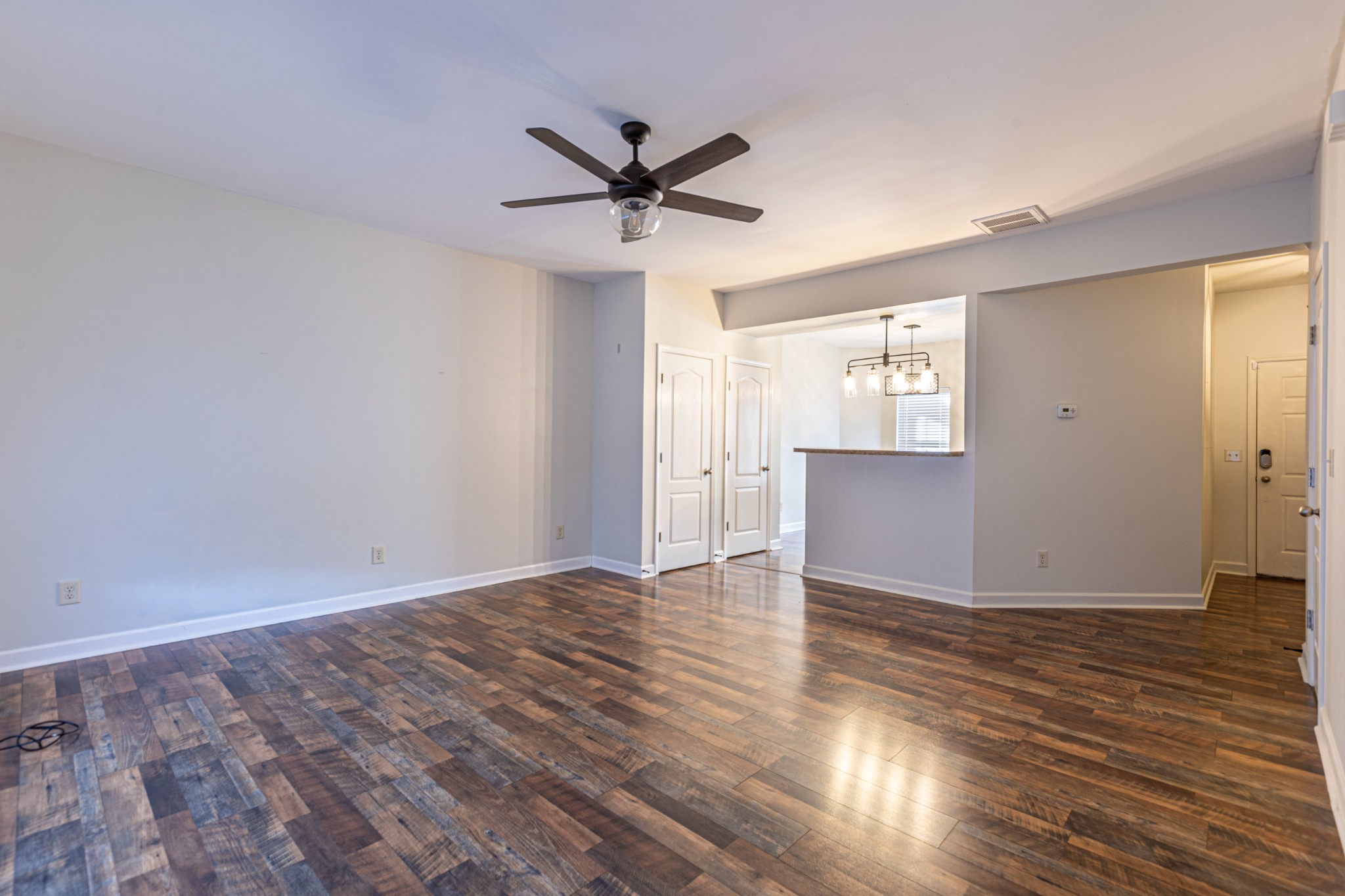 735 Tulip Grove Road, Unit 309 Hermitage, TN 37076 - Photo 7 of 18 a view of empty room with wooden floor and fan