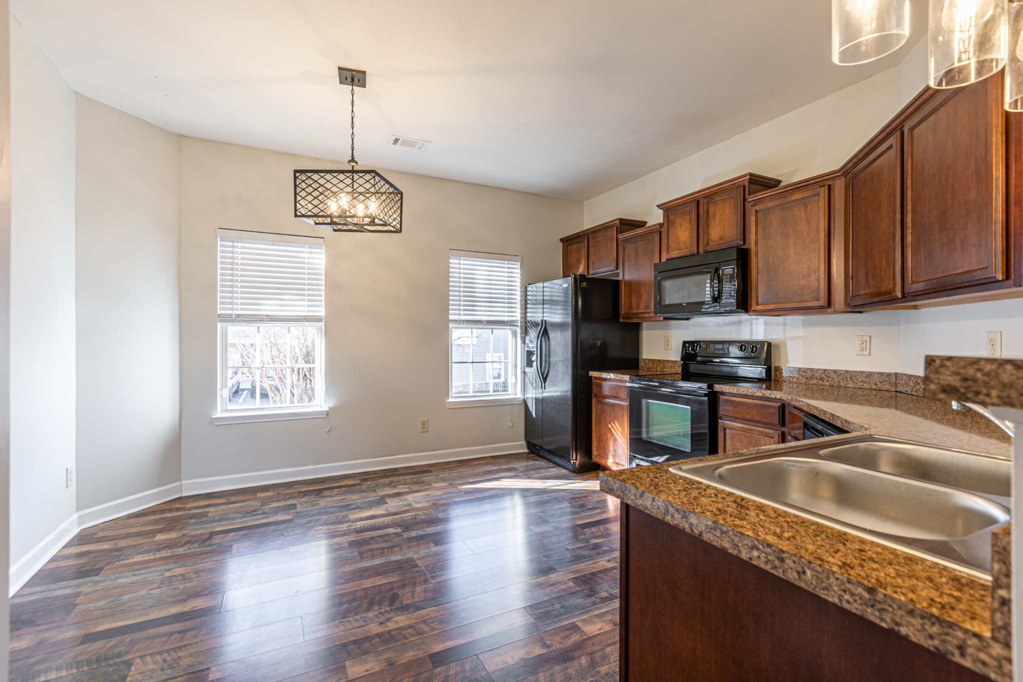 735 Tulip Grove Road, Unit 309 Hermitage, TN 37076 - Photo 9 of 18 a kitchen that has a lot of cabinets furniture and stainless steel appliances