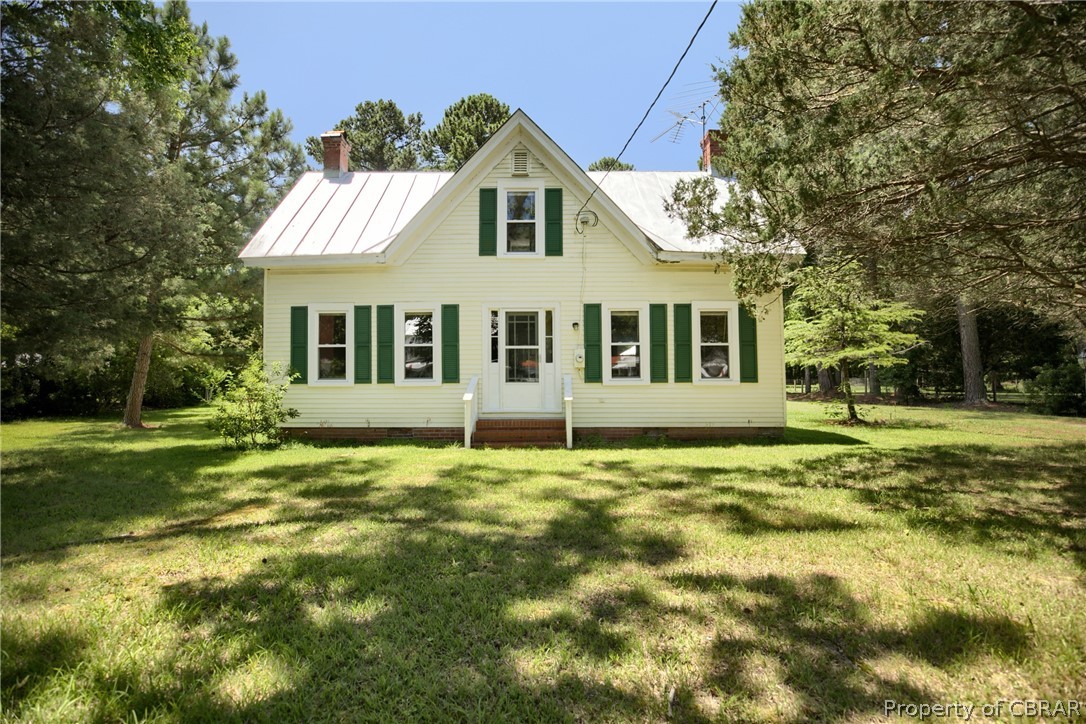 2442 Old Ferry Road Hudgins, VA 23076 - Photo 26 of 33 Rear view of property with a lawn