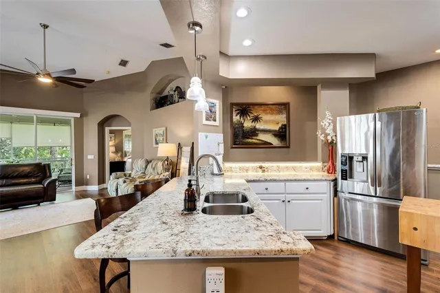 a kitchen with stainless steel appliances a stove microwave and cabinets
