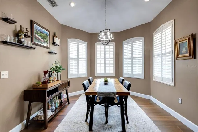 a bedroom with a bed next to a window
