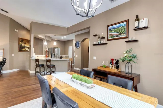 a bedroom with bed and wooden floor