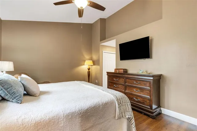 a bathroom with a granite countertop sink mirror and a bathtub
