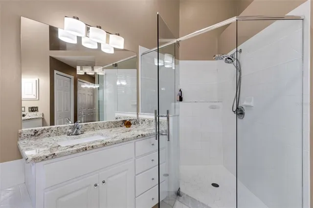 a view of a workspace with furniture and wooden floor