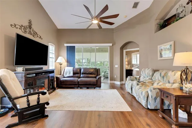 a living room with furniture and a large window