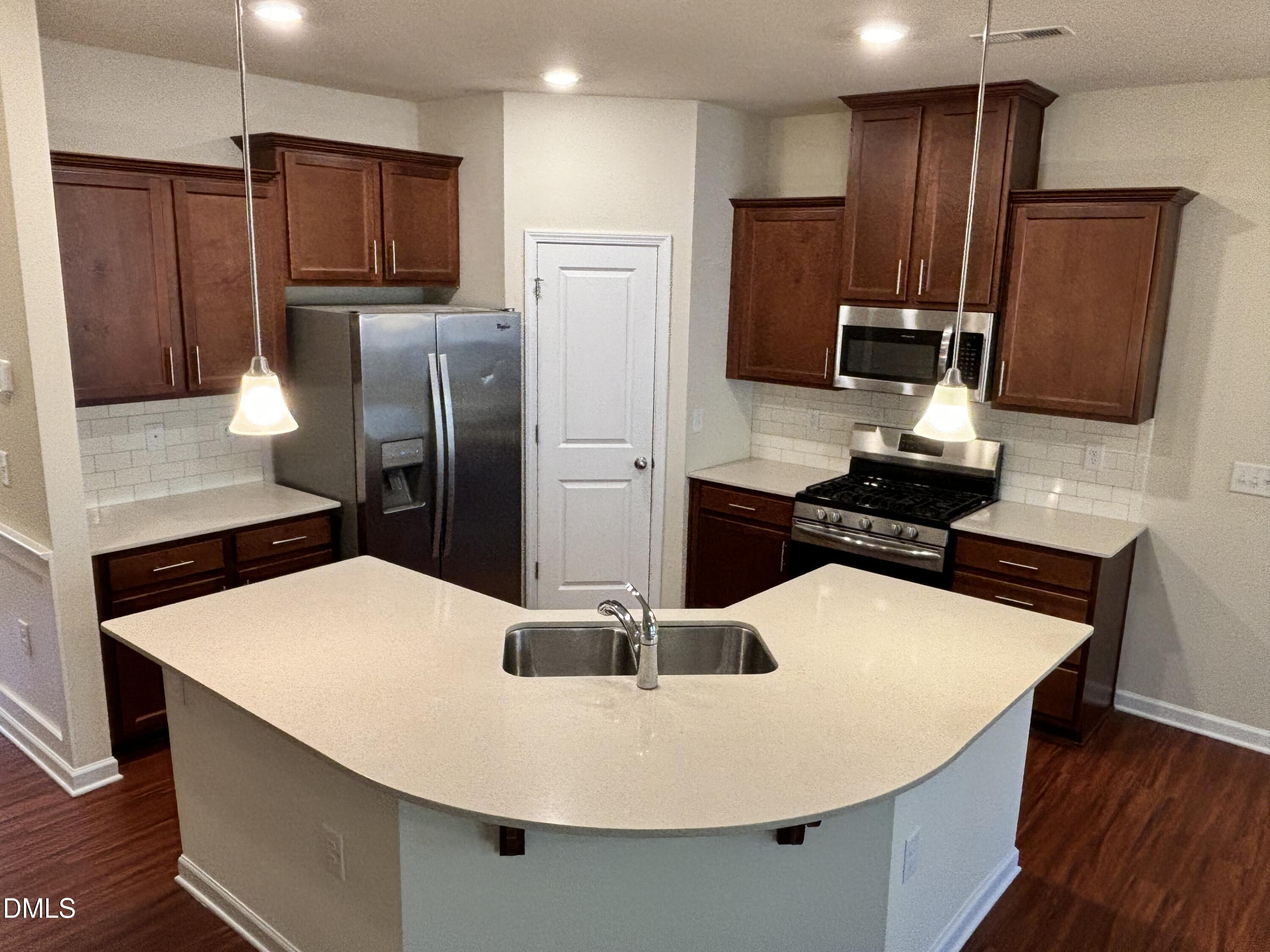 1005 Epiphany Road Morrisville, NC 27560 - Photo 8 of 21 a kitchen with stainless steel appliances a refrigerator sink and microwave