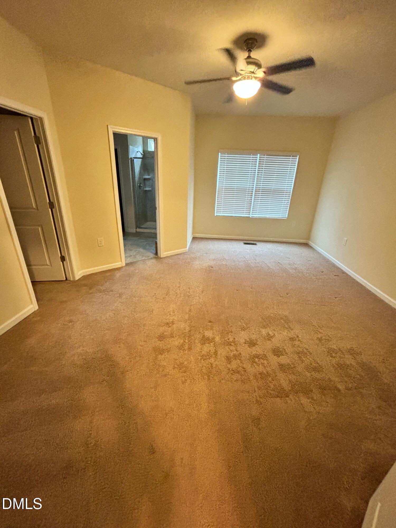 1005 Epiphany Road Morrisville, NC 27560 - Photo 10 of 21 a view of an empty room and chandelier fan