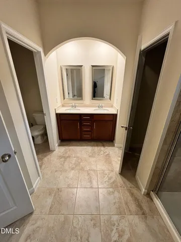 a kitchen with stainless steel appliances a refrigerator sink and microwave