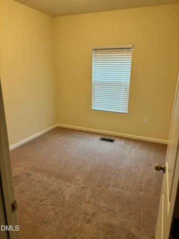 a large bathroom with a tub a sink and a mirror