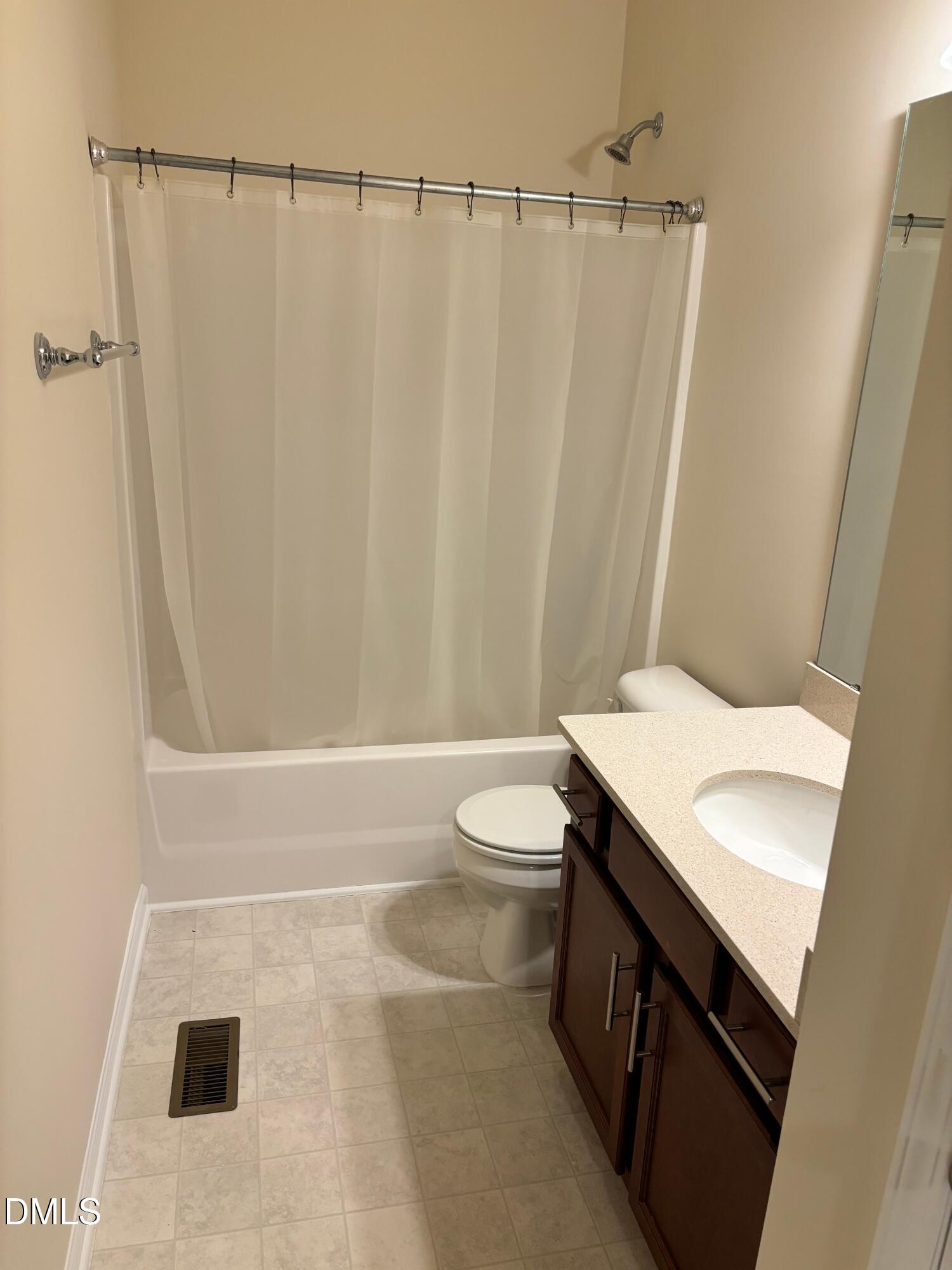 1005 Epiphany Road Morrisville, NC 27560 - Photo 16 of 21 a bathroom with a sink a toilet and shower