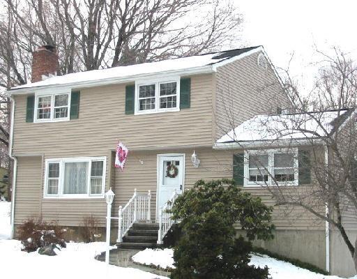 9 High Rise Road Danbury, CT 06811 - Photo 1 of 1 a front view of a house with a tree