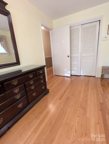 a room with wooden floor and couch