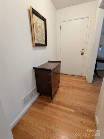 wooden floor in an empty room with a fireplace