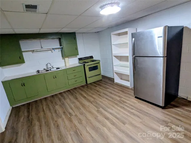 a white toilet sitting next to a bath tub and a shower