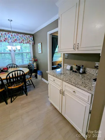 a view of an empty room and wooden floor