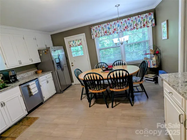 a room with wooden floor and furniture