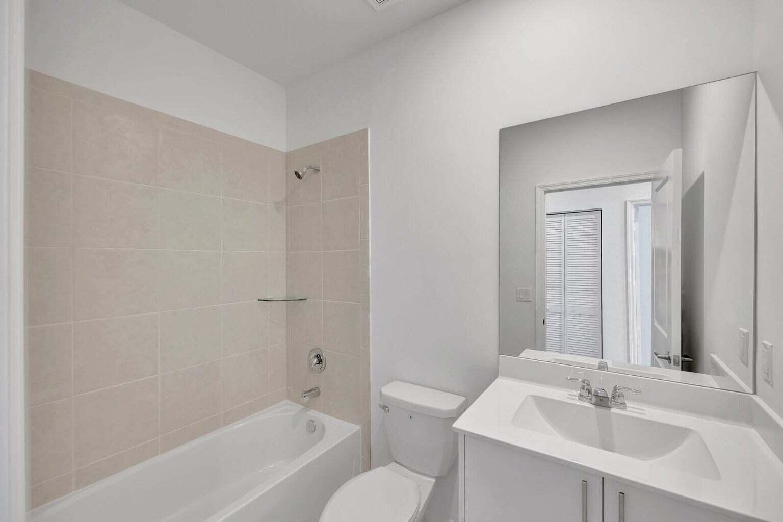 29190 Southwest 163rd Court Homestead, FL 33033 - Photo 12 of 15 a bathroom with a bathtub shower sink and a toilet