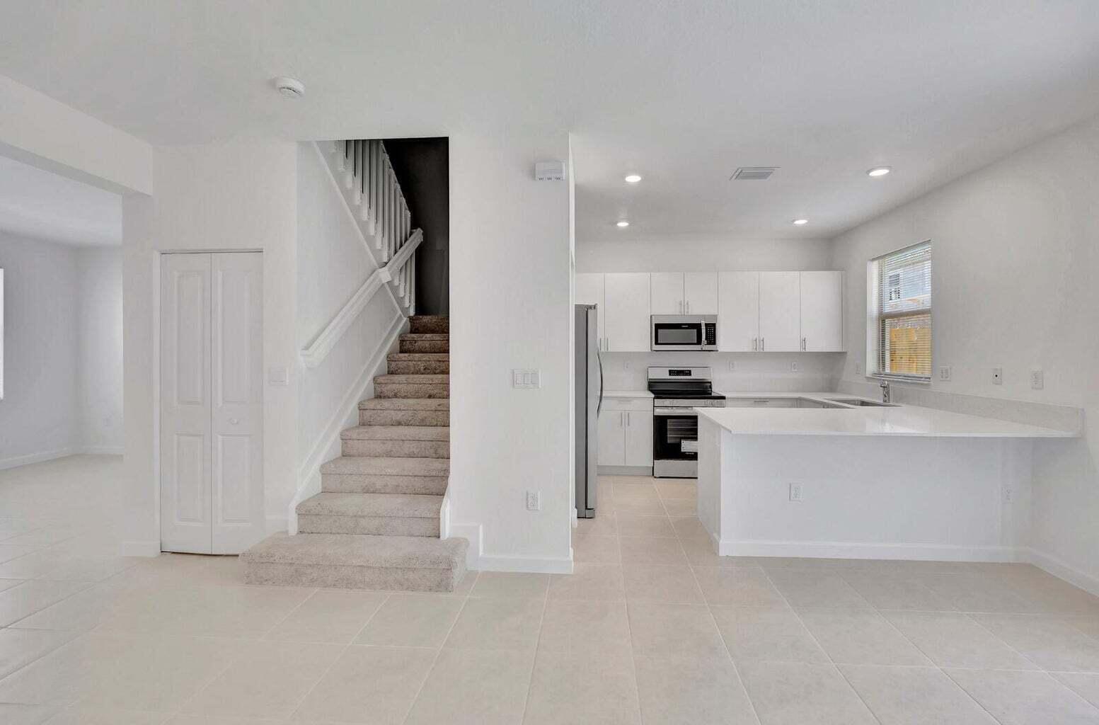29190 Southwest 163rd Court Homestead, FL 33033 - Photo 2 of 15 a view of kitchen with wooden floor and electronic appliances