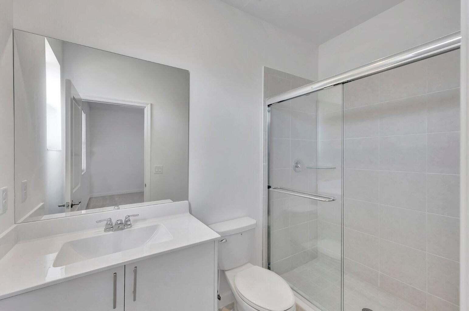 29190 Southwest 163rd Court Homestead, FL 33033 - Photo 7 of 15 a bathroom with a sink toilet and shower
