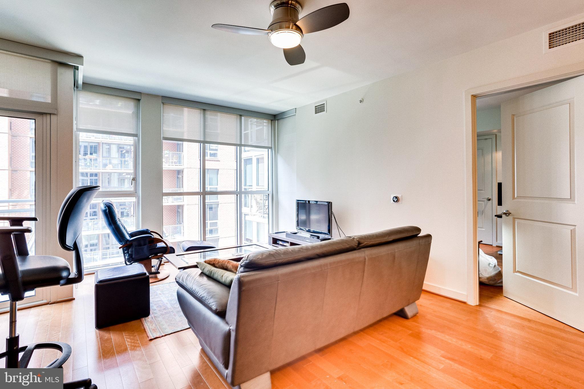 1025 First Street Southeast, Unit 801 Washington, DC 20003 - Photo 15 of 55 Floor-to-ceiling windows in the living room