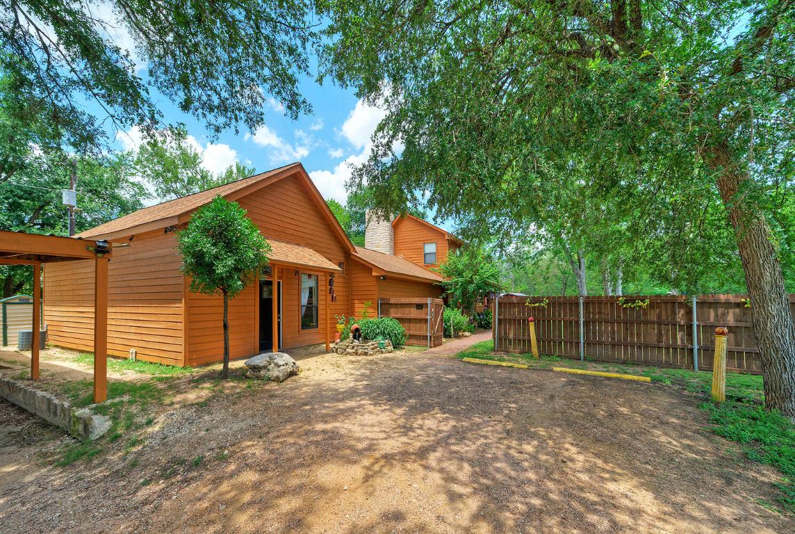 828 Water Street Manor, TX 78653 - Photo 2 of 19 a view of a house with a yard