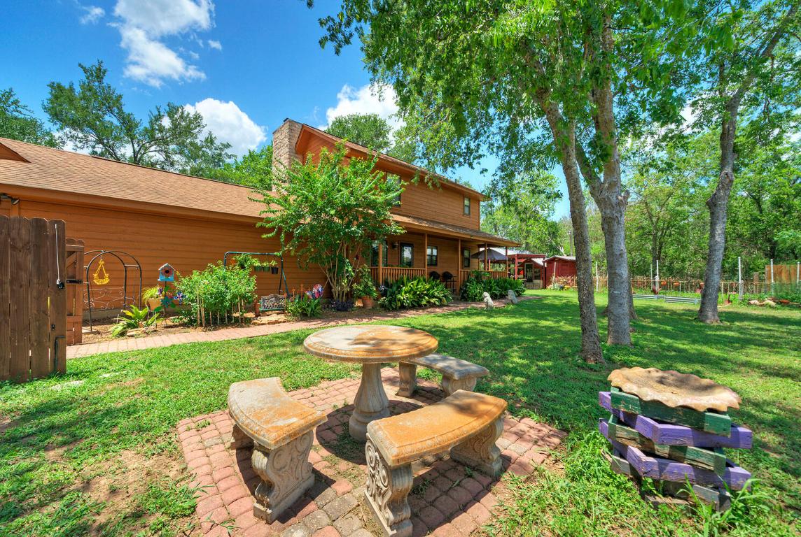 828 Water Street Manor, TX 78653 - Photo 3 of 19 a view of a yard with furniture