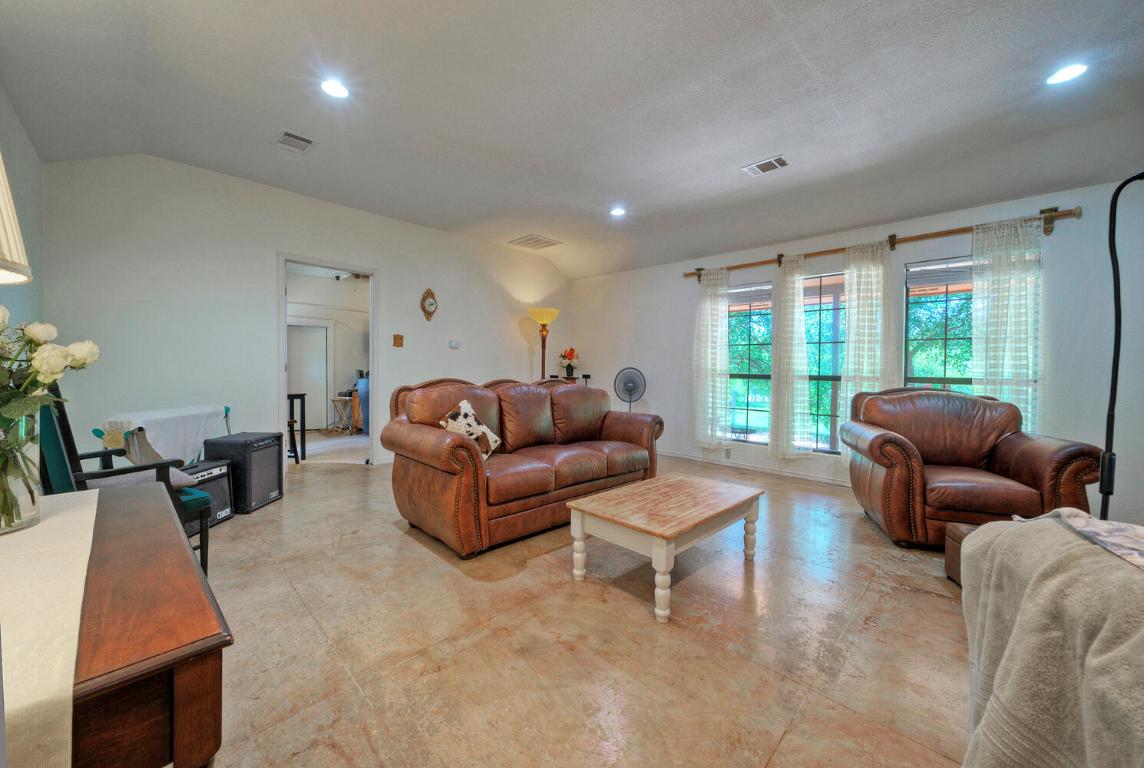 828 Water Street Manor, TX 78653 - Photo 5 of 19 a living room with furniture and a large window