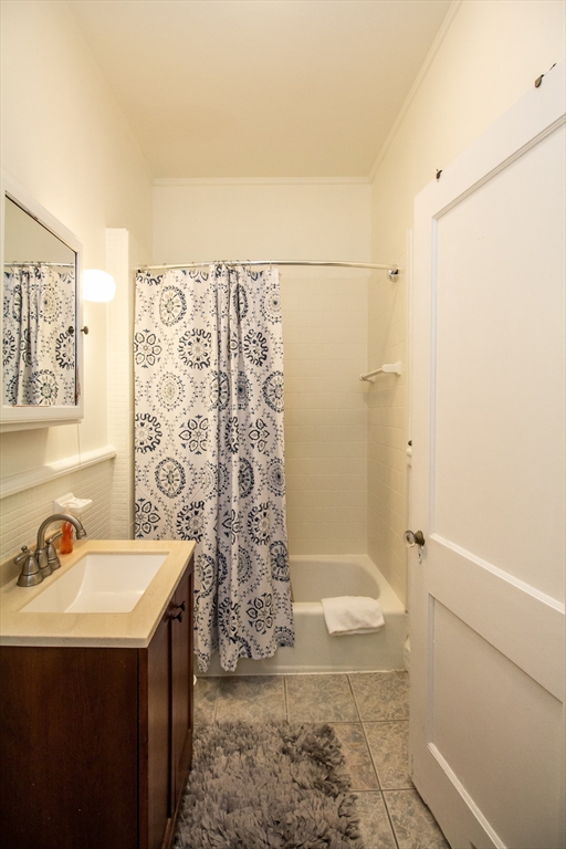 1253 Beacon Street, Unit C4 Brookline, MA 02446 - Photo 8 of 10 a bathroom with a sink a toilet and shower