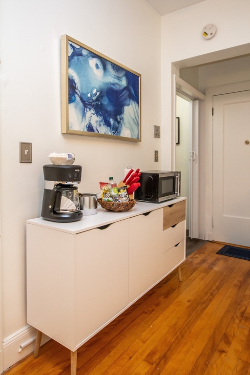1253 Beacon Street, Unit C4 Brookline, MA 02446 - Photo 9 of 10 a kitchen with a sink and cabinets