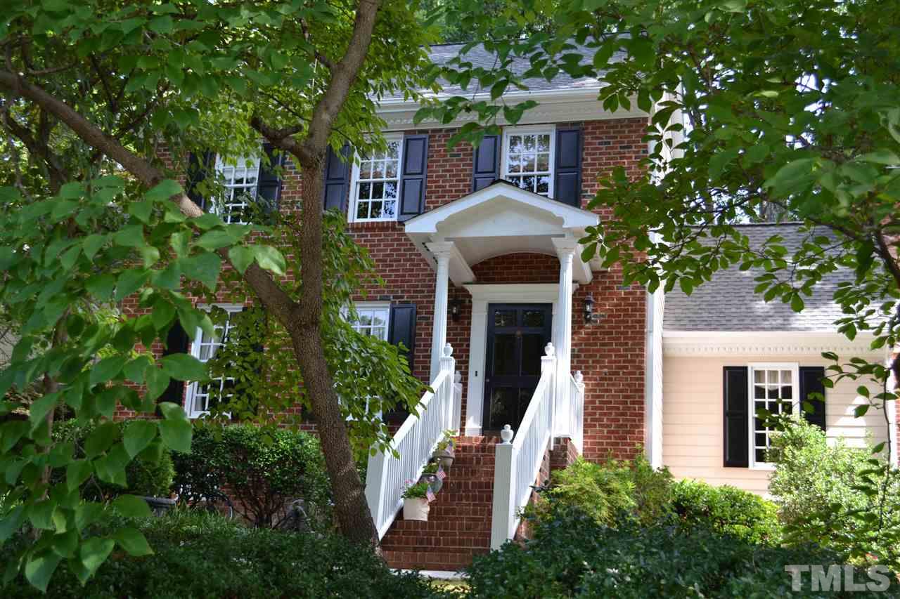 2320 Pastille Lane Raleigh, NC 27612 - Photo 2 of 25 a front view of a house with a yard and potted plants